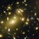 Gravity Bending Light (Amazing Galaxy Cluster Photo)